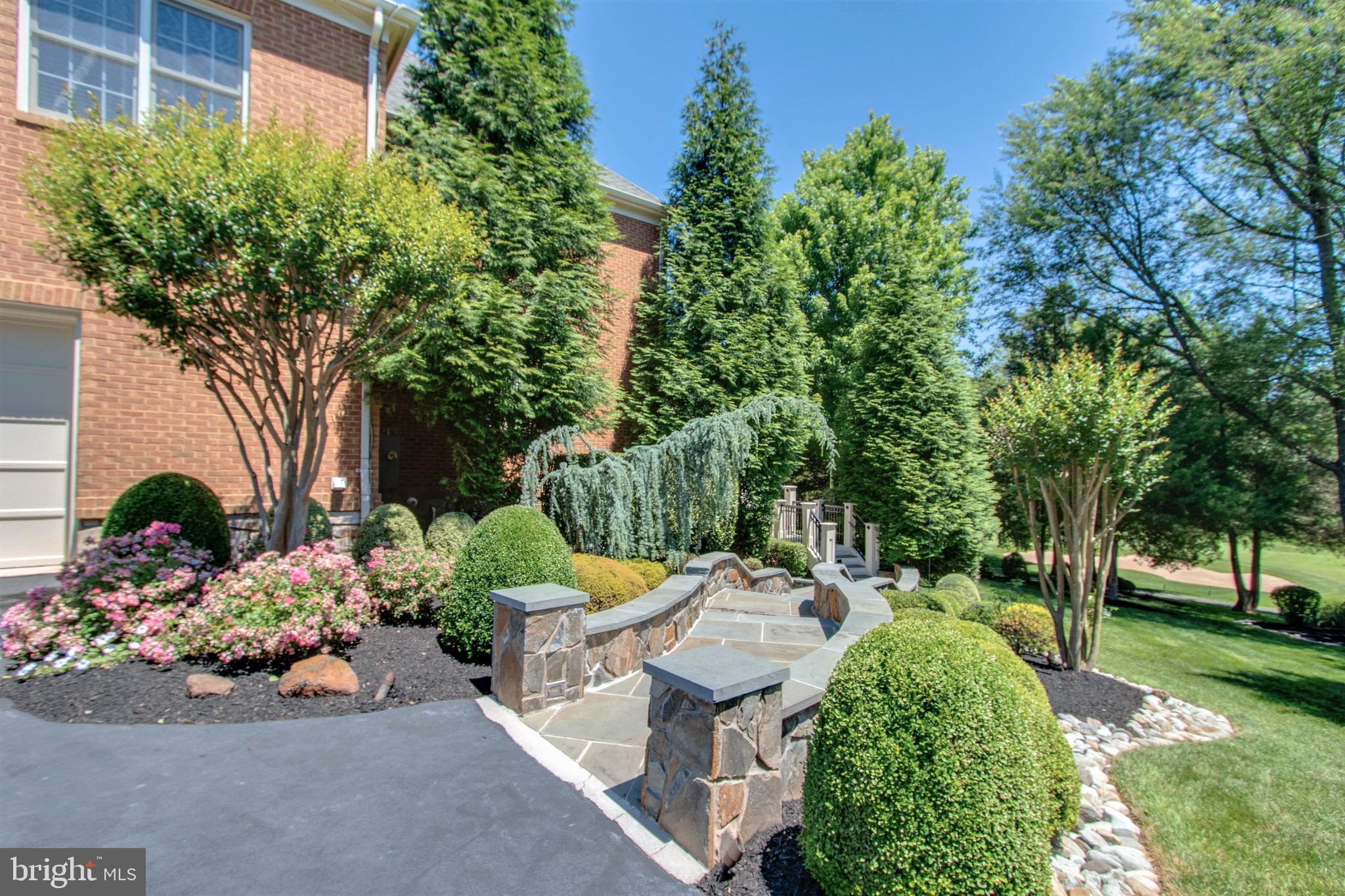 8314 Roxborough Loop Gainesville, VA 20155 - Photo 5 of 93 Lush Landscaping & Stone Walkway