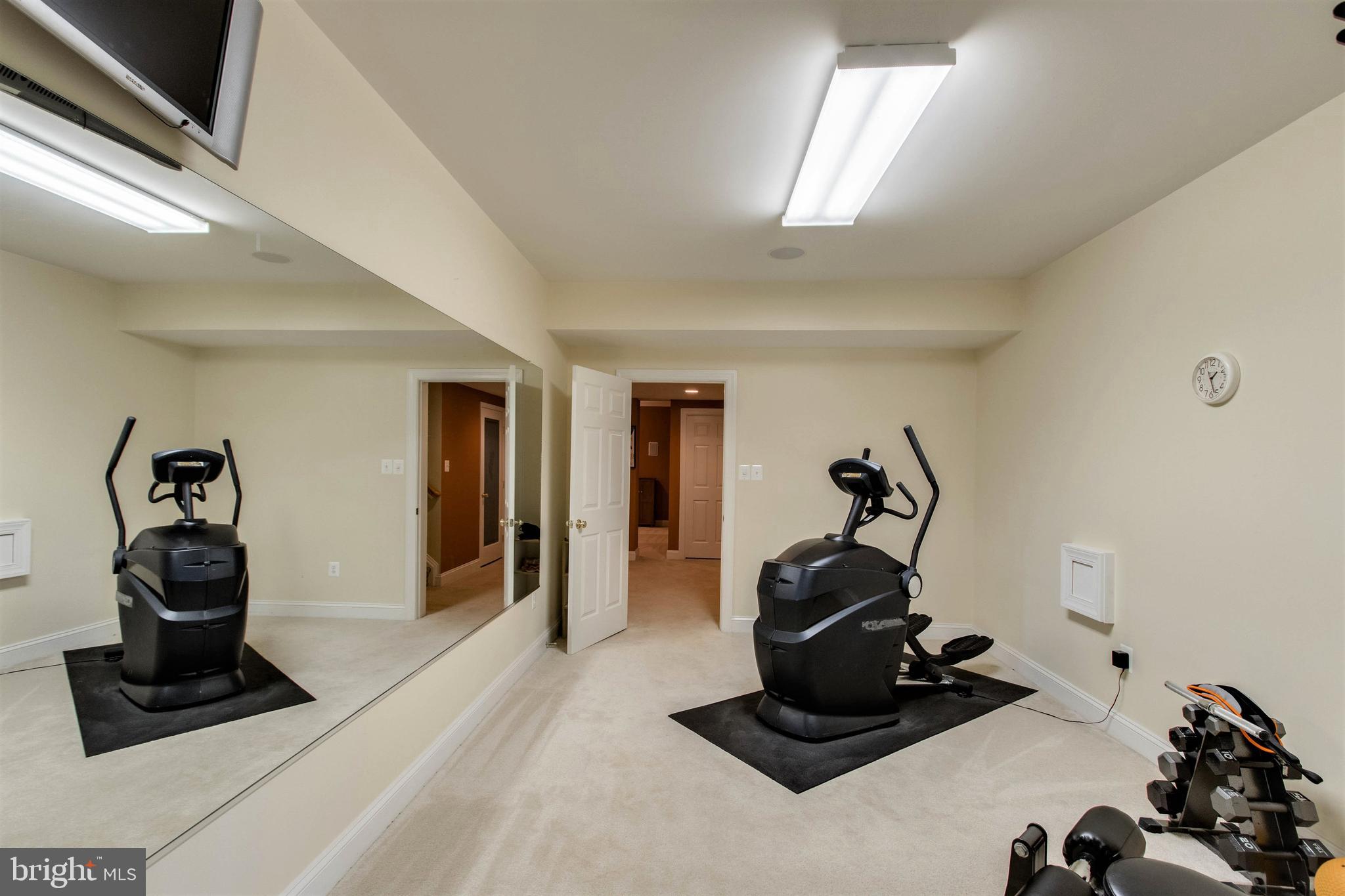 8314 Roxborough Loop Gainesville, VA 20155 - Photo 67 of 93 Exercise Room - TV & Machines convey