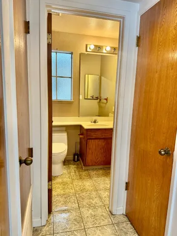 a bathroom with a tub sink and toilet