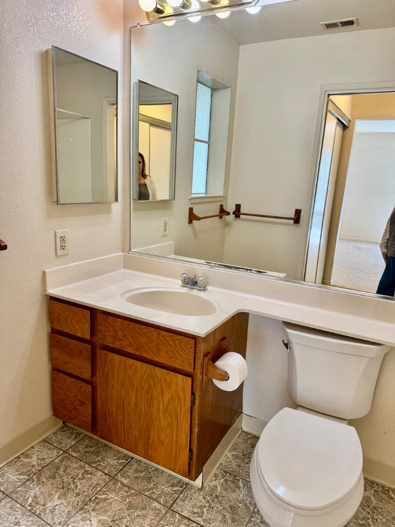 460 Pine Avenue Half Moon Bay, CA 94019 - Photo 16 of 21 a bathroom with a toilet sink and mirror