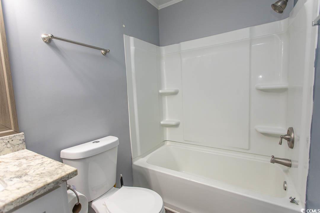 950 Forestbrook Road, Unit C3 Myrtle Beach, SC 29579 - Photo 10 of 19 Full bathroom with shower combination, vanity, and crown molding