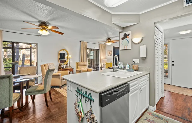 a view of kitchen island a sink and living room