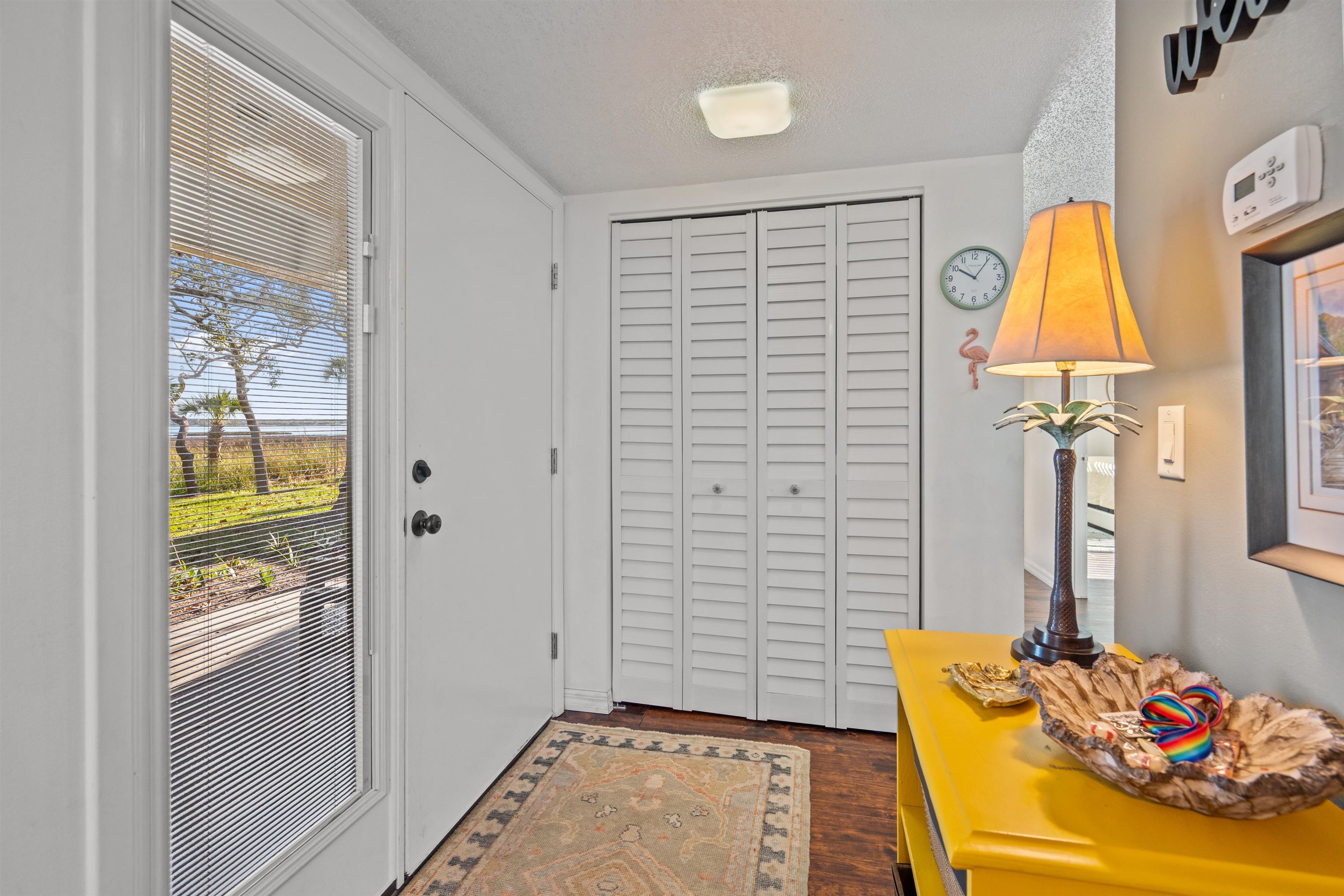 11 Tarragona Court St. Augustine, FL 32086 - Photo 23 of 33 a bedroom with a bed and a chandelier