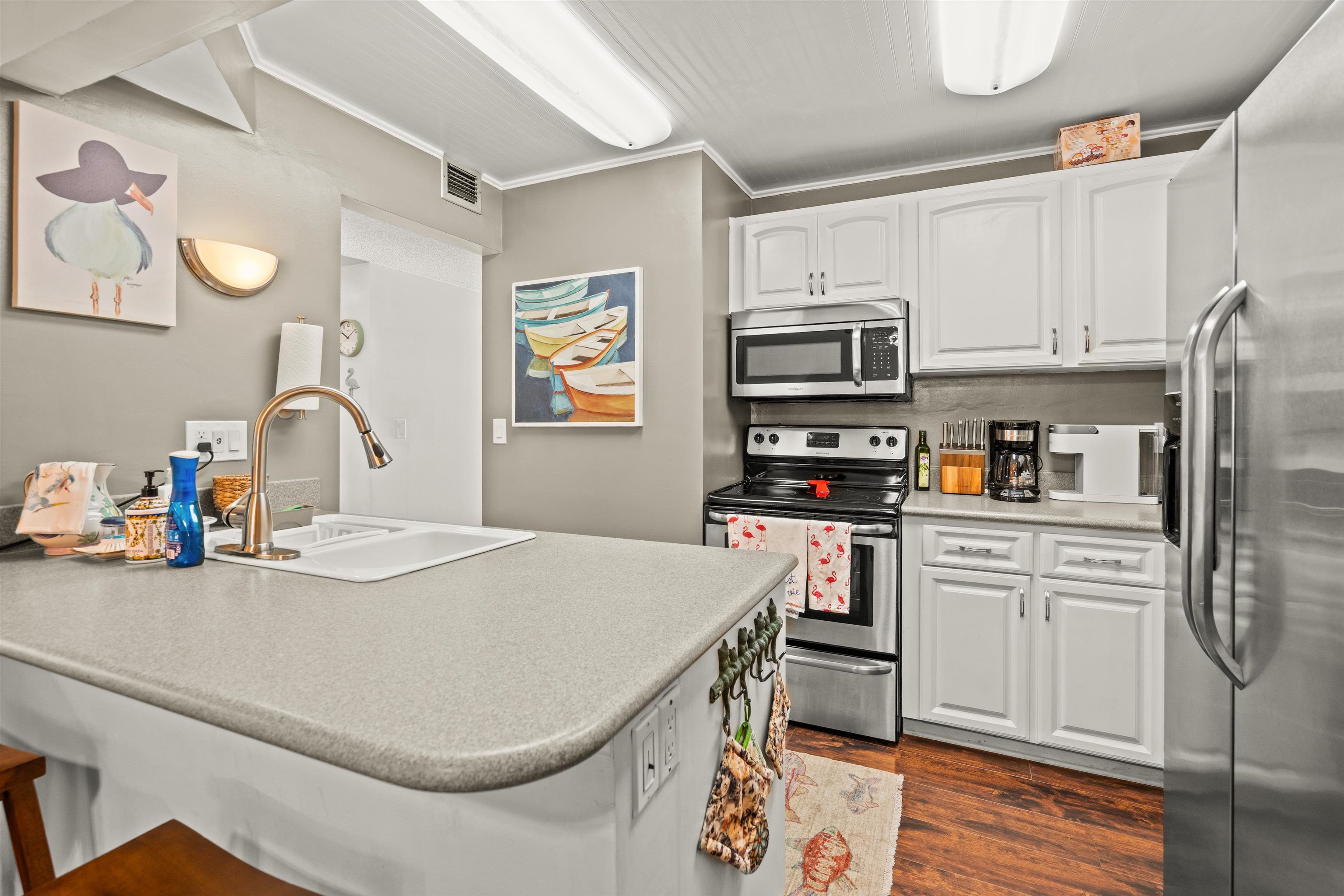 11 Tarragona Court St. Augustine, FL 32086 - Photo 28 of 33 a kitchen with a sink appliances and cabinets