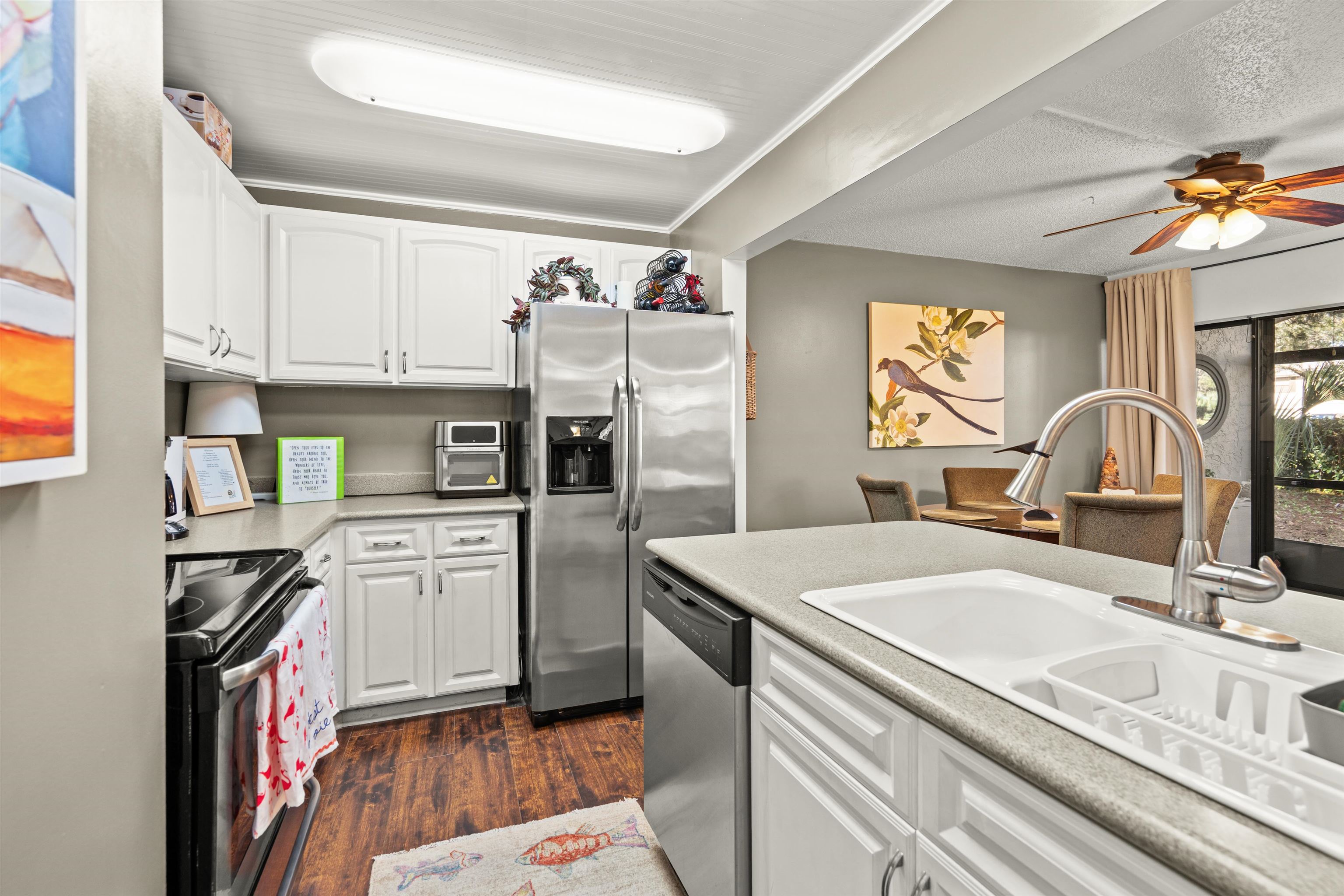 11 Tarragona Court St. Augustine, FL 32086 - Photo 29 of 33 a kitchen with stainless steel appliances granite countertop a sink stove and refrigerator