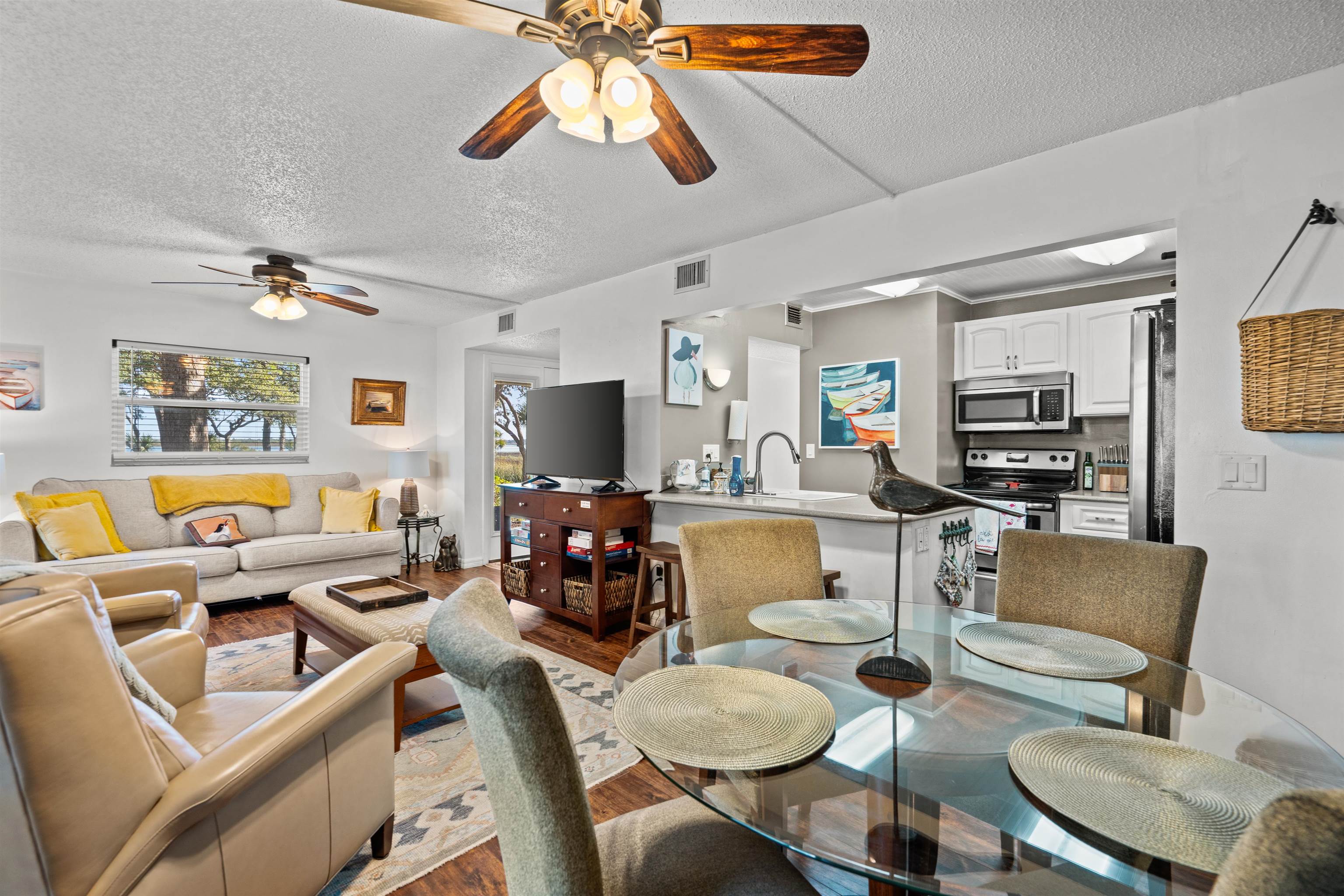 11 Tarragona Court St. Augustine, FL 32086 - Photo 30 of 33 a living room with furniture a flat screen tv and kitchen view