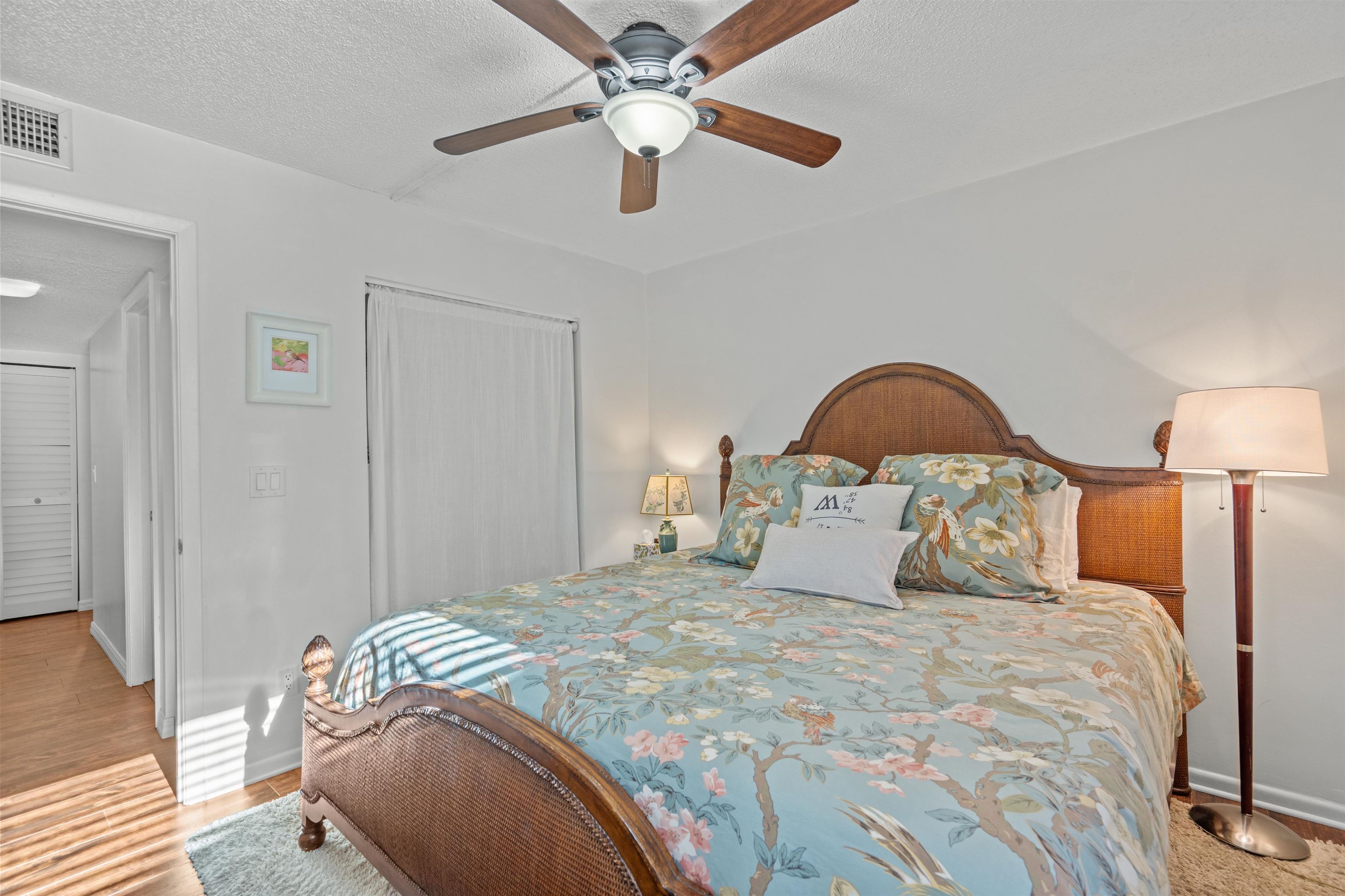 11 Tarragona Court St. Augustine, FL 32086 - Photo 6 of 33 a bedroom with a bed and a chandelier