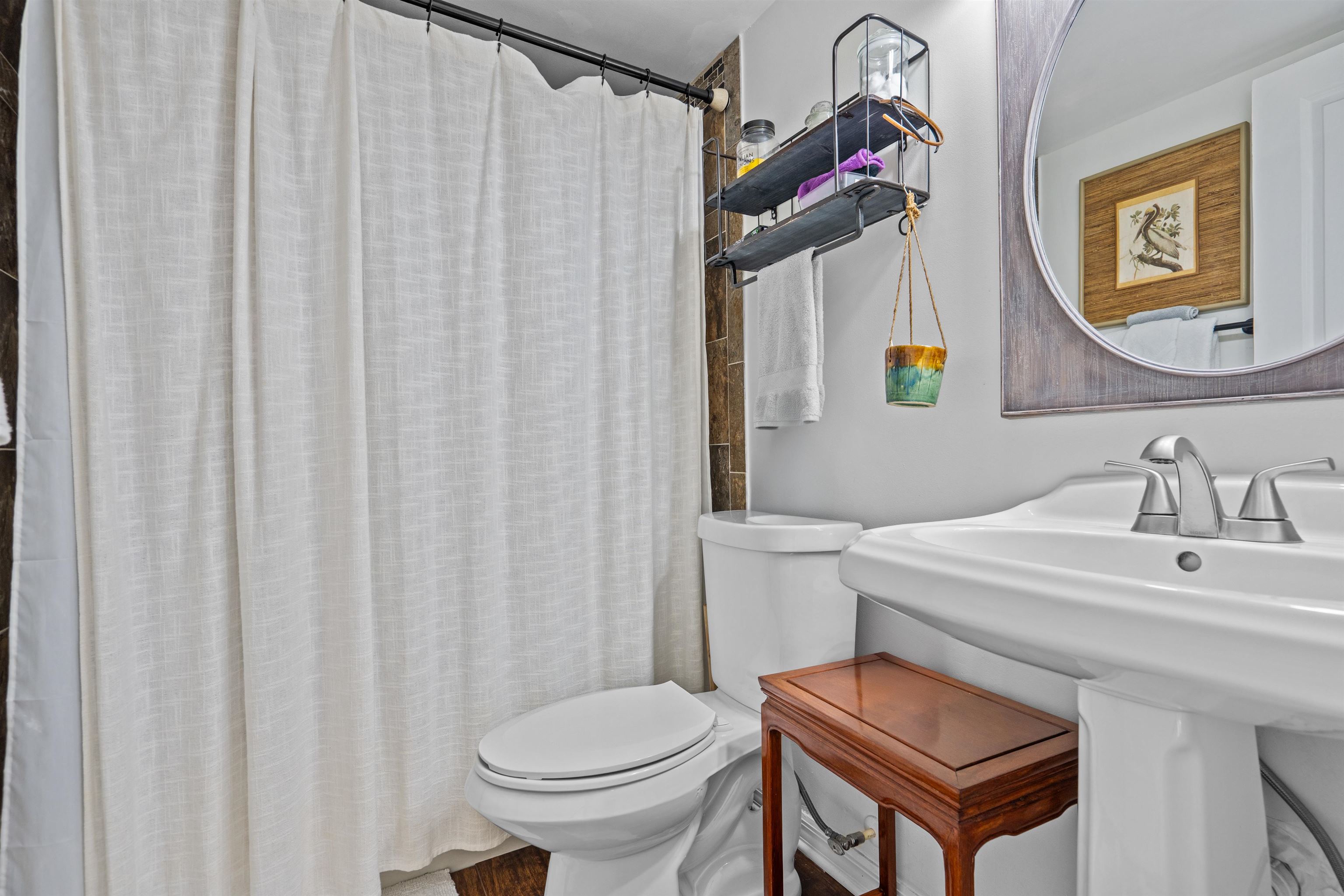 11 Tarragona Court St. Augustine, FL 32086 - Photo 7 of 33 a bathroom with a sink toilet and mirror