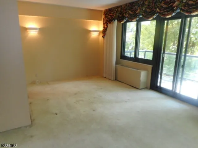 a view of a room with a large window