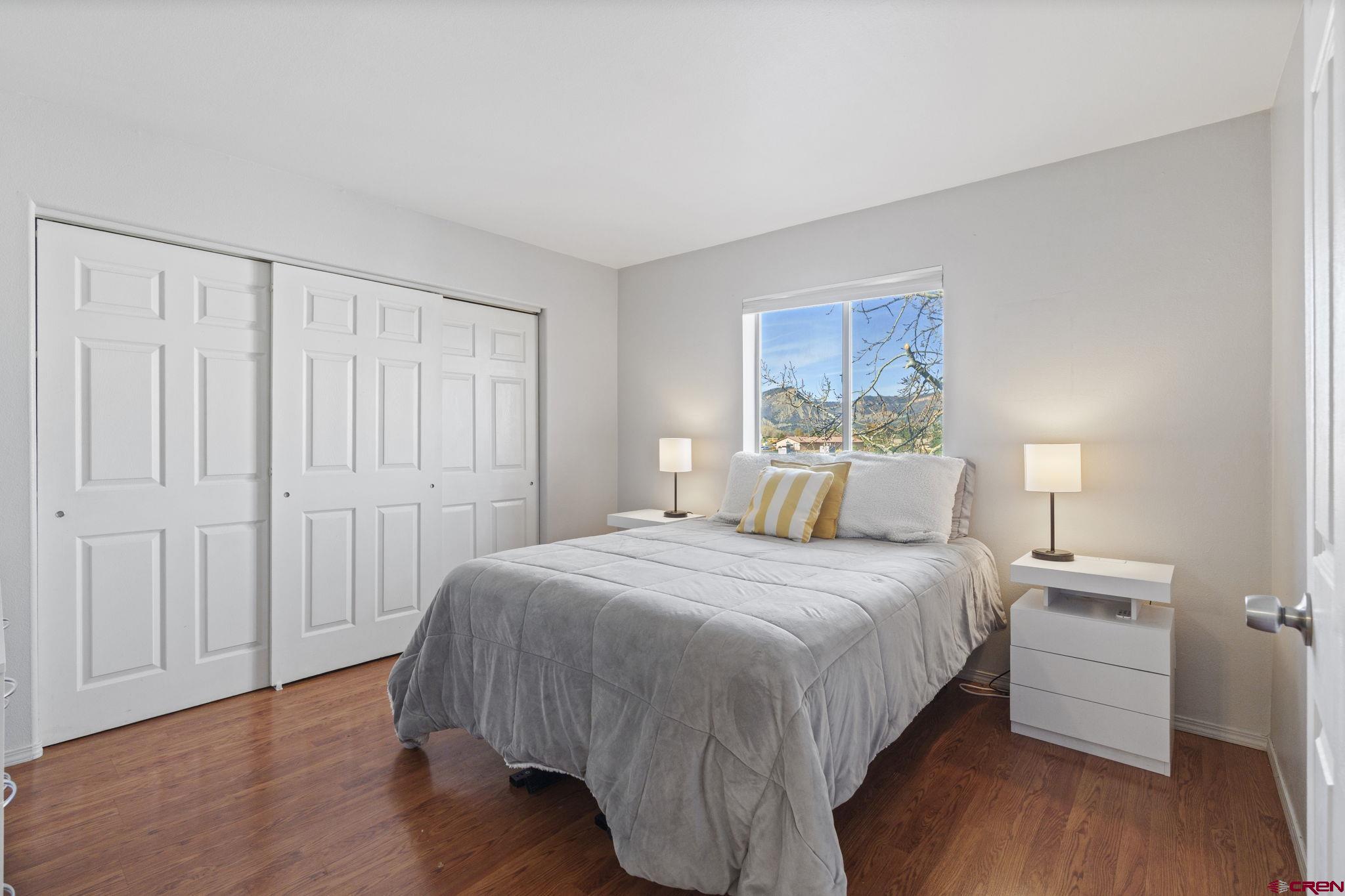 1100 Goeglein Gulch Road, Unit 233 Durango, CO 81301 - Photo 12 of 37 a bedroom with a bed and a closet