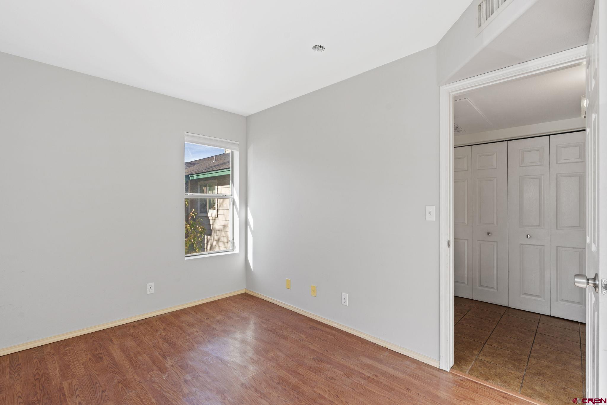1100 Goeglein Gulch Road, Unit 233 Durango, CO 81301 - Photo 20 of 37 an empty room with windows and closet