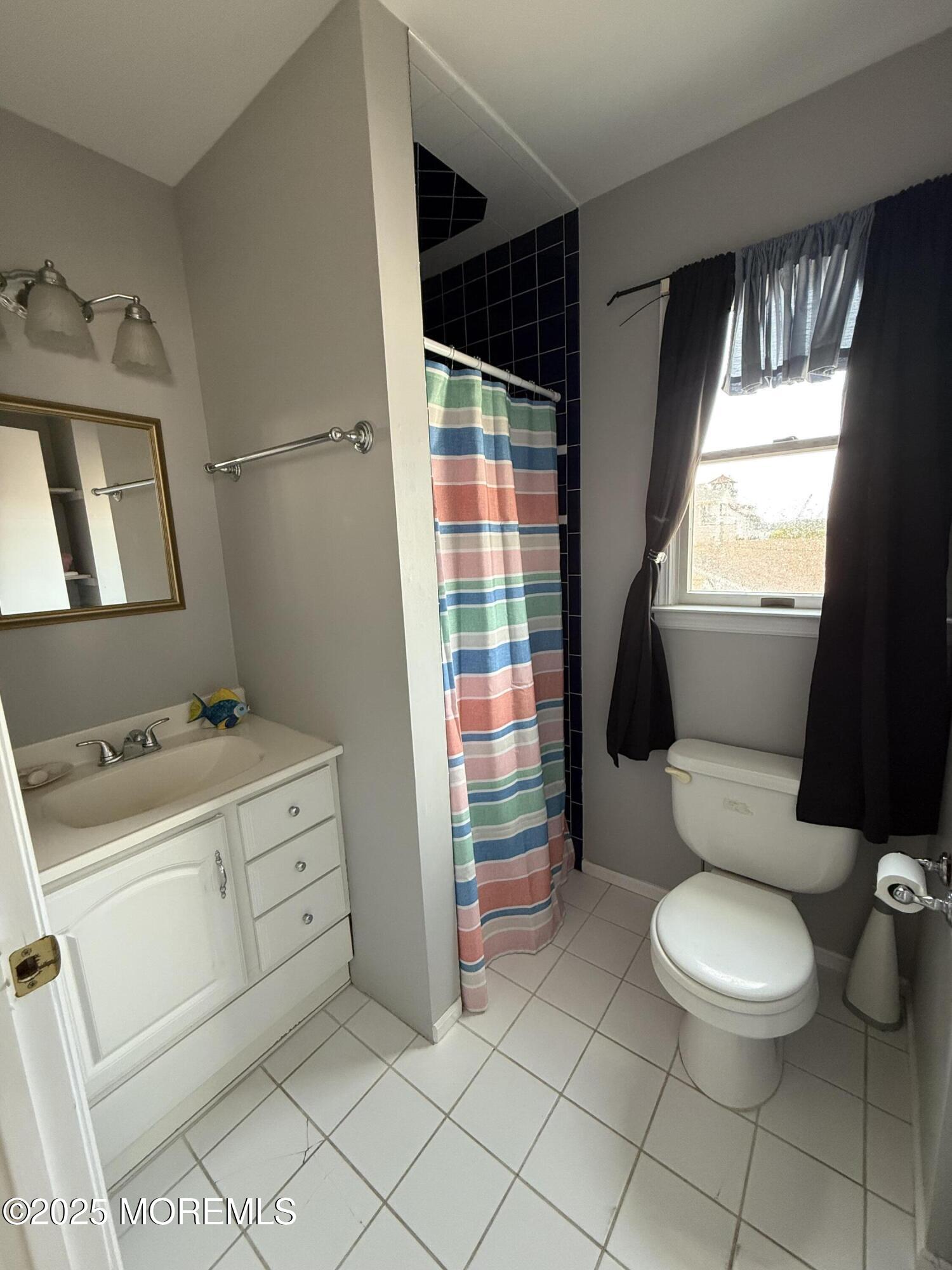 62 A Inlet Drive Point Pleasant Beach, NJ 08742 - Photo 14 of 24 a bathroom with a sink toilet and shower