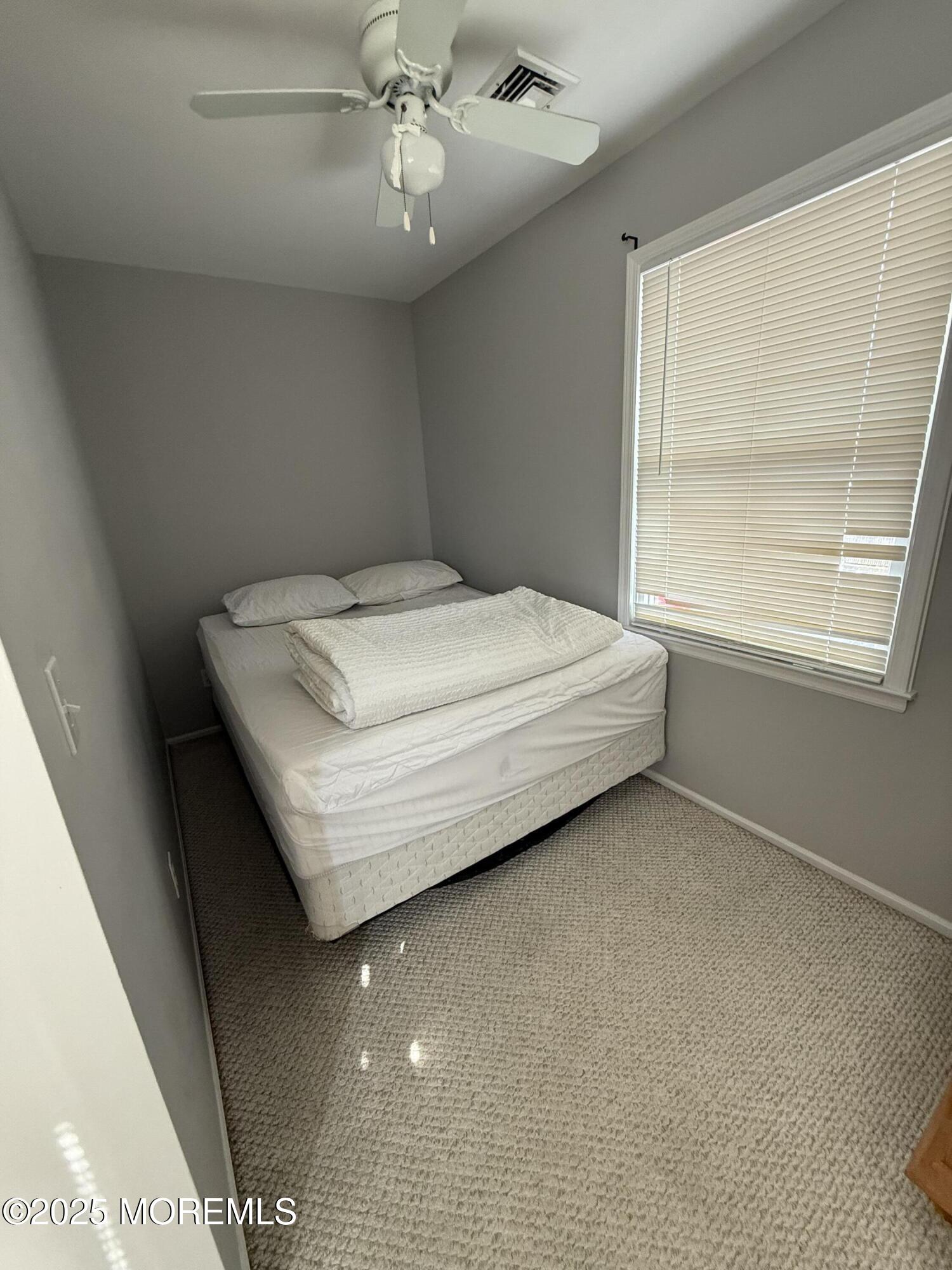 62 A Inlet Drive Point Pleasant Beach, NJ 08742 - Photo 15 of 24 a bed sitting in a room next to a window