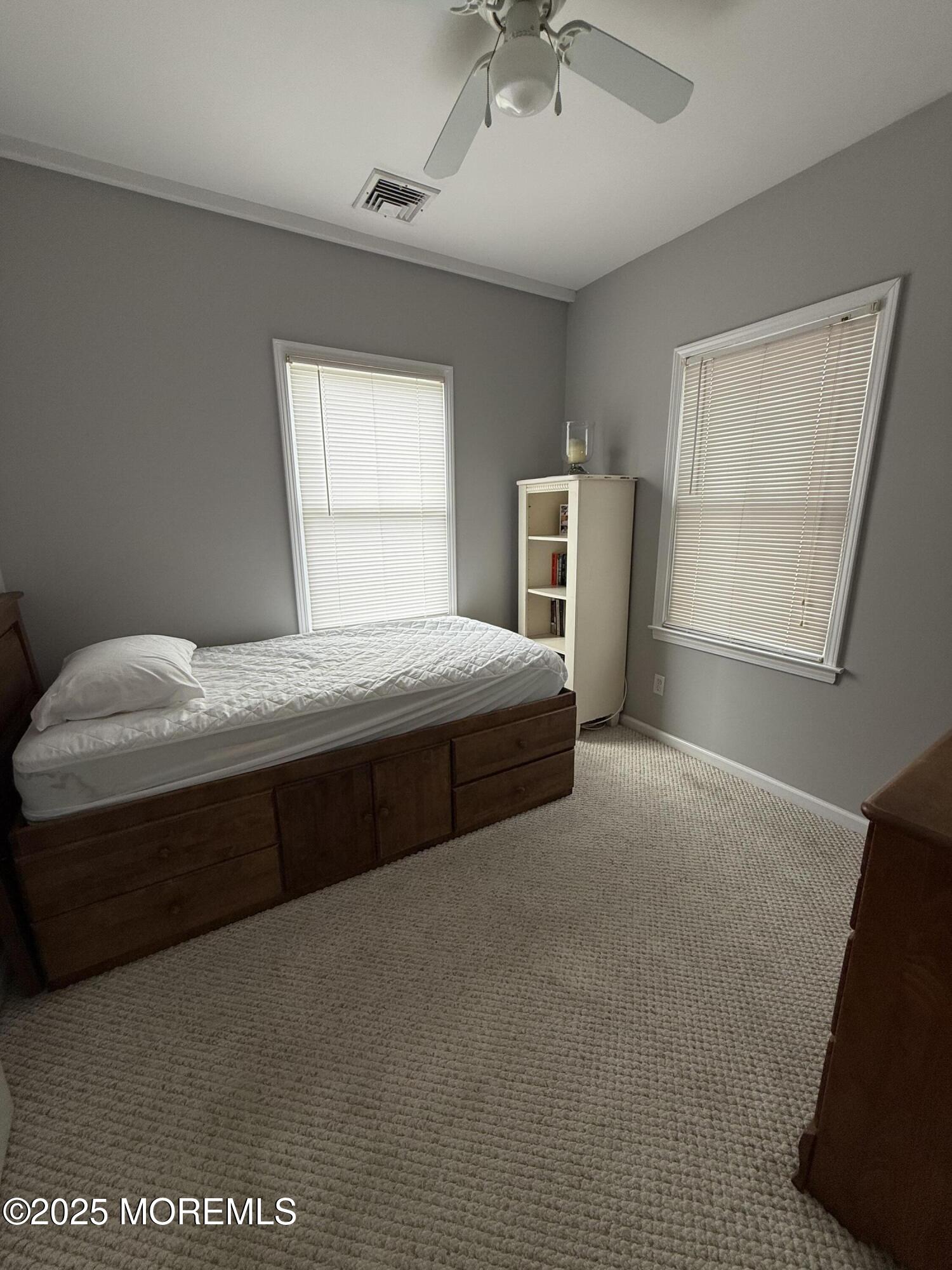 62 A Inlet Drive Point Pleasant Beach, NJ 08742 - Photo 6 of 24 a bedroom with a bed dresser and a window