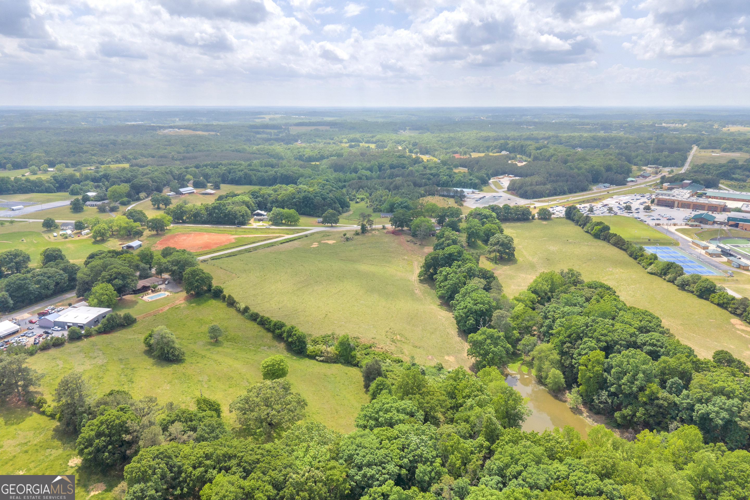 6490 Highway 145 Carnesville, GA 30521 - Photo 5 of 29 an aerial view of residential houses with outdoor space