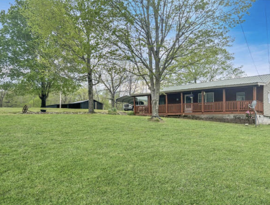 237 Higgs Road Big Rock, TN 37023 - Photo 1 of 19 a front view of a house with a garden