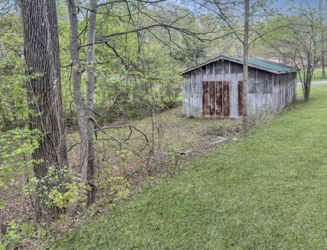 237 Higgs Road Big Rock, TN 37023 - Photo 15 of 19 a view of a house with a yard