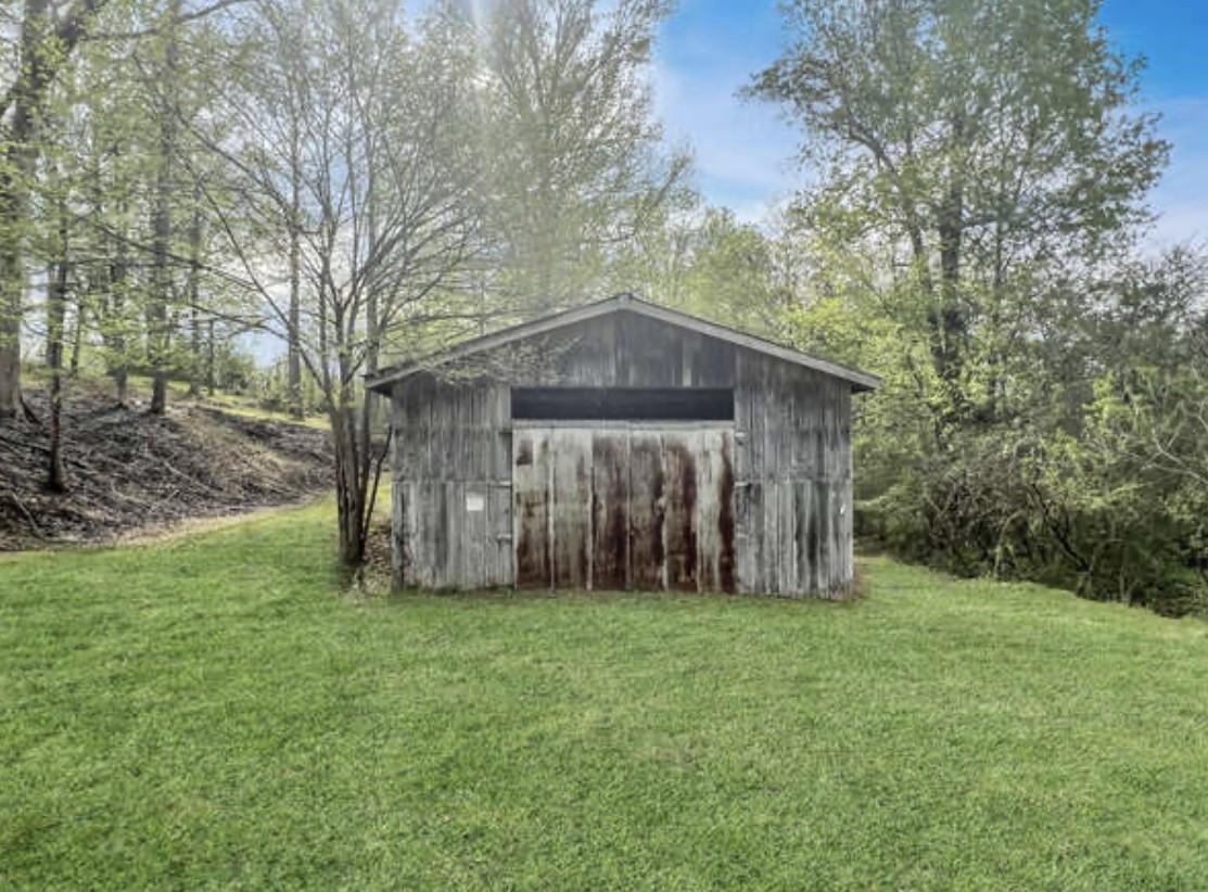 237 Higgs Road Big Rock, TN 37023 - Photo 16 of 19 a view of a house with backyard and garden