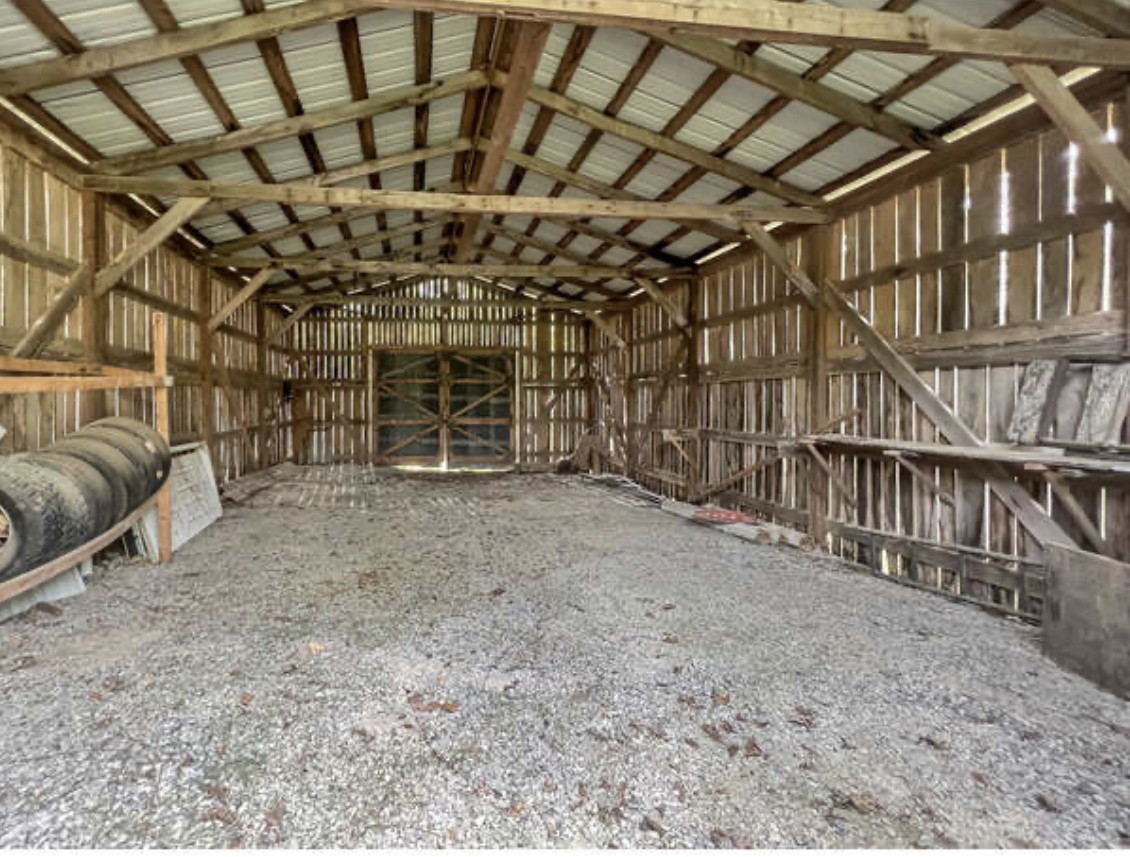 237 Higgs Road Big Rock, TN 37023 - Photo 17 of 19 a view of an empty room with wooden floor