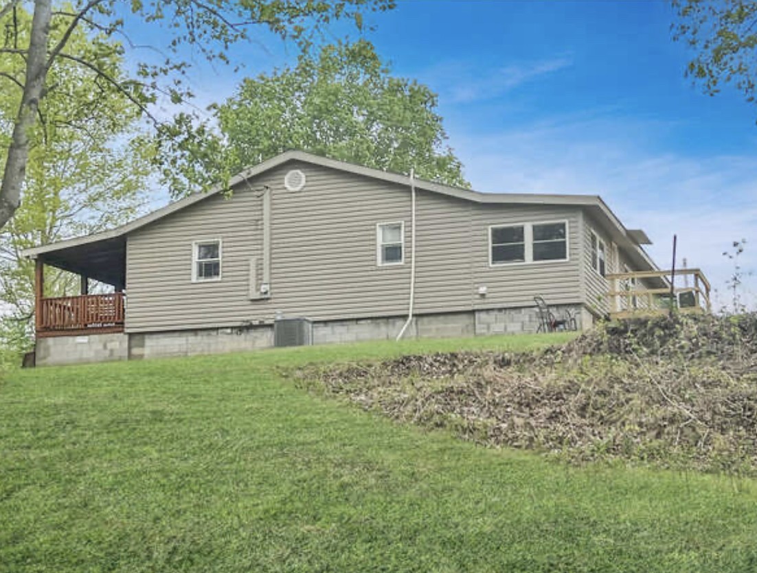 237 Higgs Road Big Rock, TN 37023 - Photo 18 of 19 a backyard of a house with lots of green space