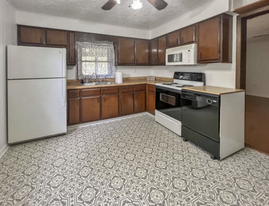 237 Higgs Road Big Rock, TN 37023 - Photo 5 of 19 a kitchen with stainless steel appliances granite countertop a refrigerator sink and stove