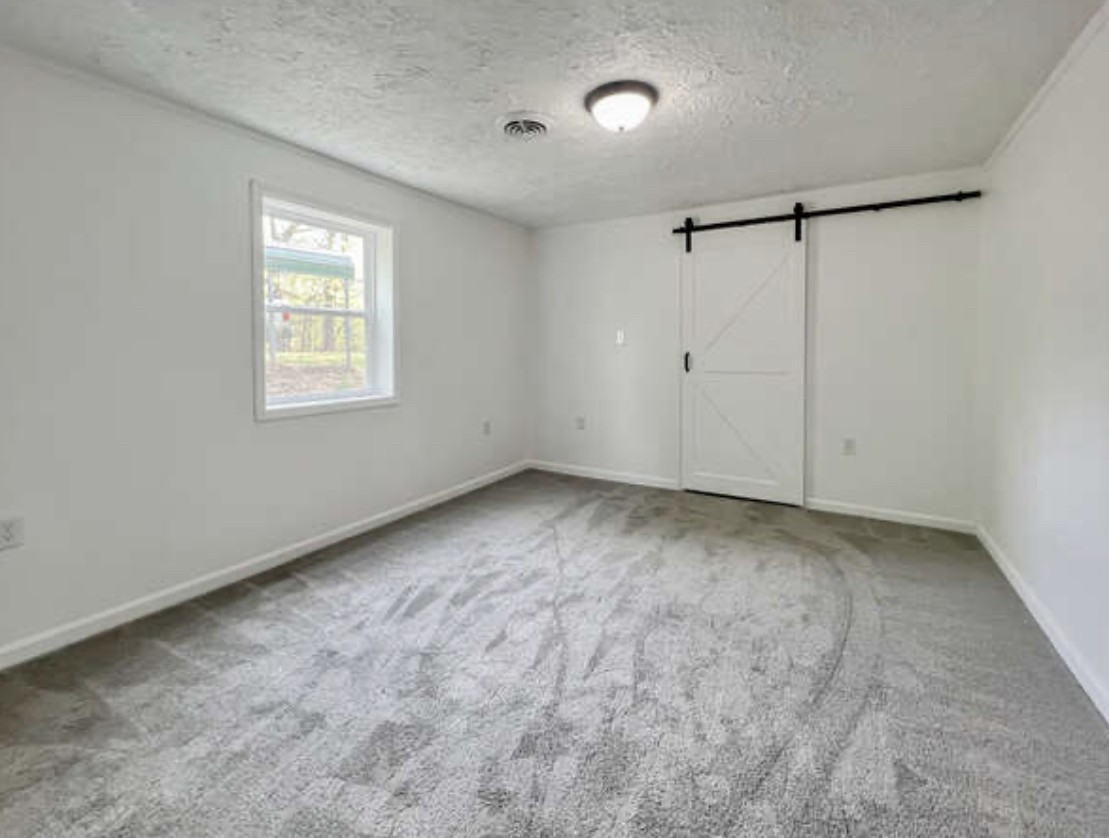 237 Higgs Road Big Rock, TN 37023 - Photo 9 of 19 a view of an empty room with a window