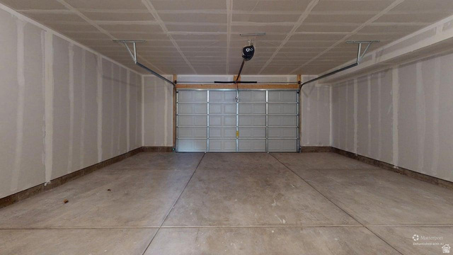 777 Pheasantbrook Drive, Unit 2B Centerville, UT 84014 - Photo 38 of 42 Spacious garage with a sectional overhead door and a ceiling-mounted opener