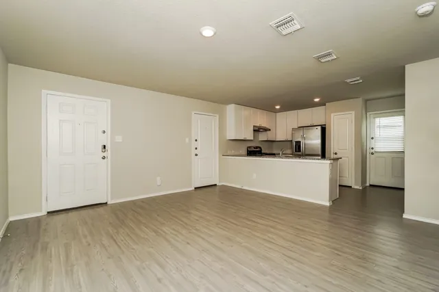 a view of kitchen with wooden floor