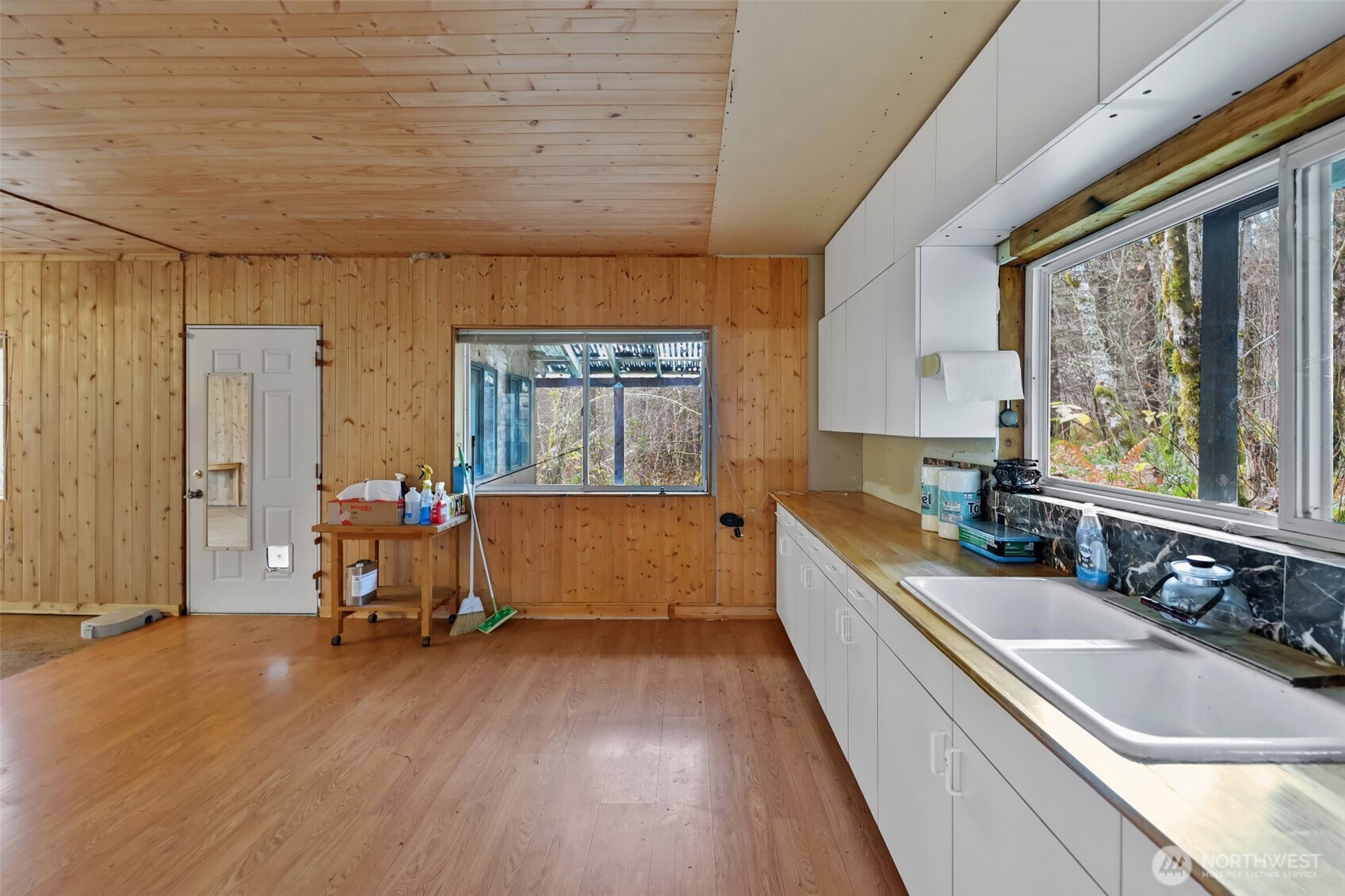 15411 Alder Mashel Connection Road East Eatonville, WA 98328 - Photo 5 of 18 a large white kitchen with a large window