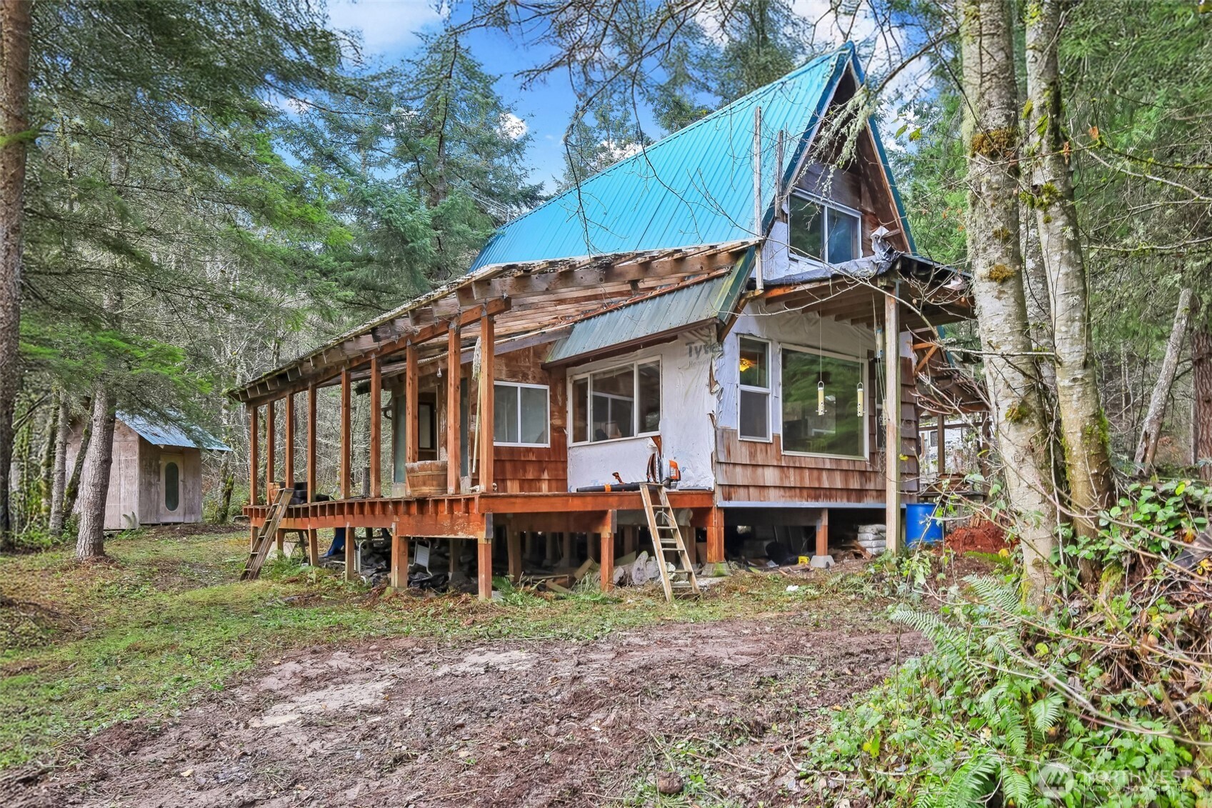 15411 Alder Mashel Connection Road East Eatonville, WA 98328 - Photo 8 of 18 a view of a house with a yard and sitting area