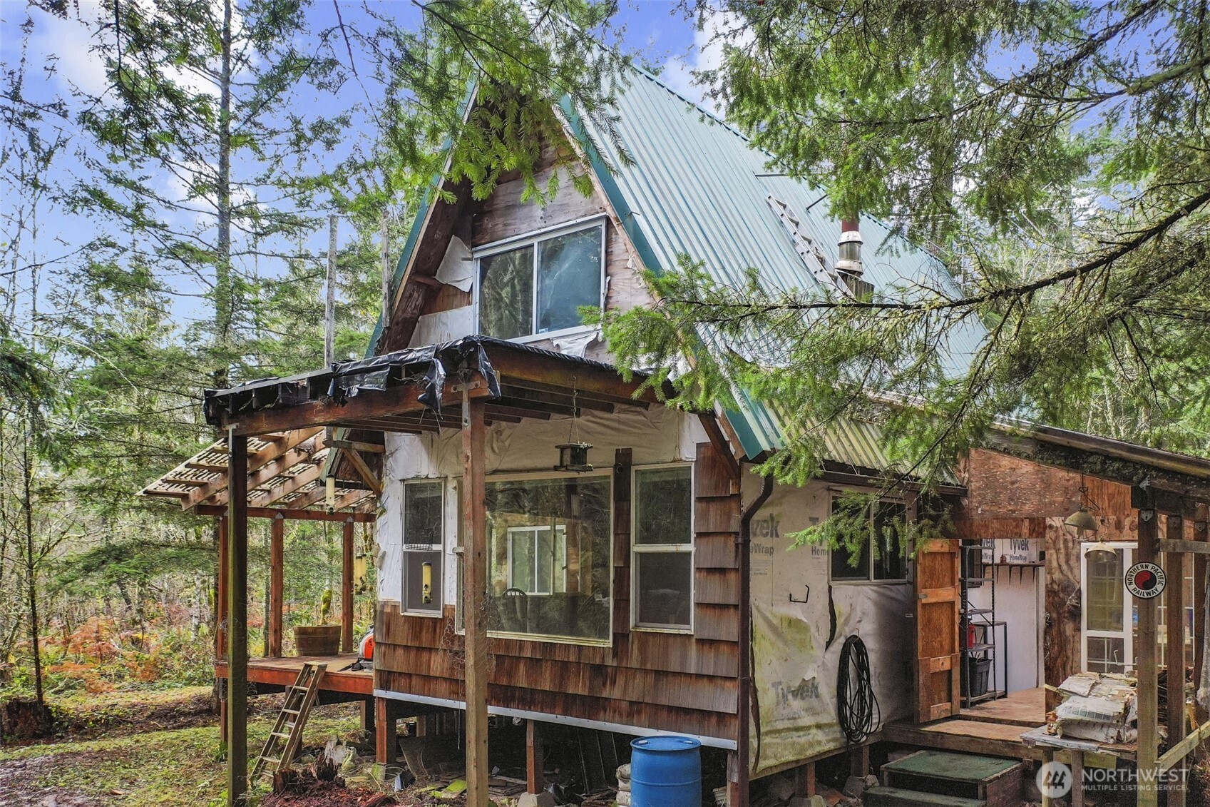 15411 Alder Mashel Connection Road East Eatonville, WA 98328 - Photo 10 of 18 a view of a house with a tree