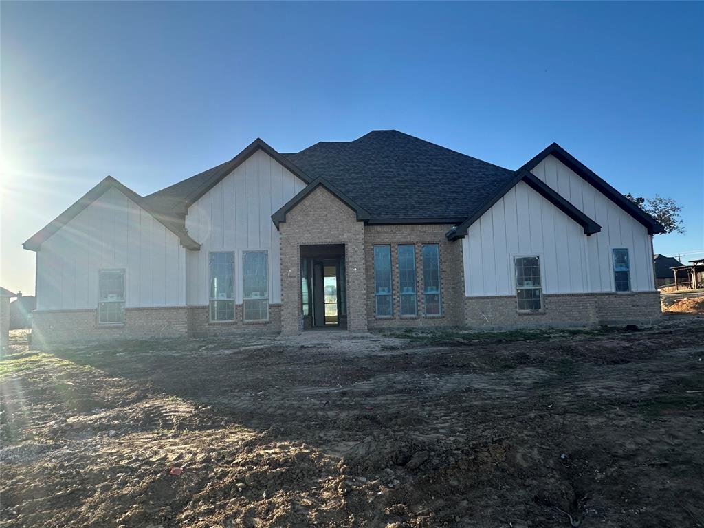 201 Stuart Street Paradise, TX 76073 - Photo 2 of 18 a view of a house with a yard