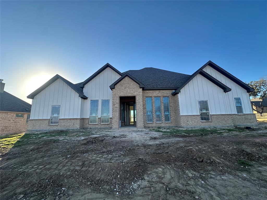 201 Stuart Street Paradise, TX 76073 - Photo 3 of 18 a house view with a backyard space