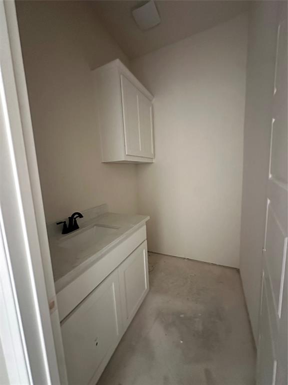 201 Stuart Street Paradise, TX 76073 - Photo 5 of 18 a utility room with a sink