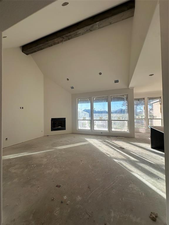 201 Stuart Street Paradise, TX 76073 - Photo 6 of 18 a view of an empty room with a fireplace and a window