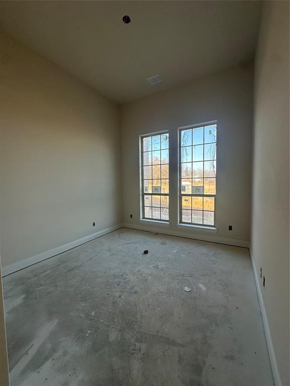 201 Stuart Street Paradise, TX 76073 - Photo 7 of 18 an empty room with windows
