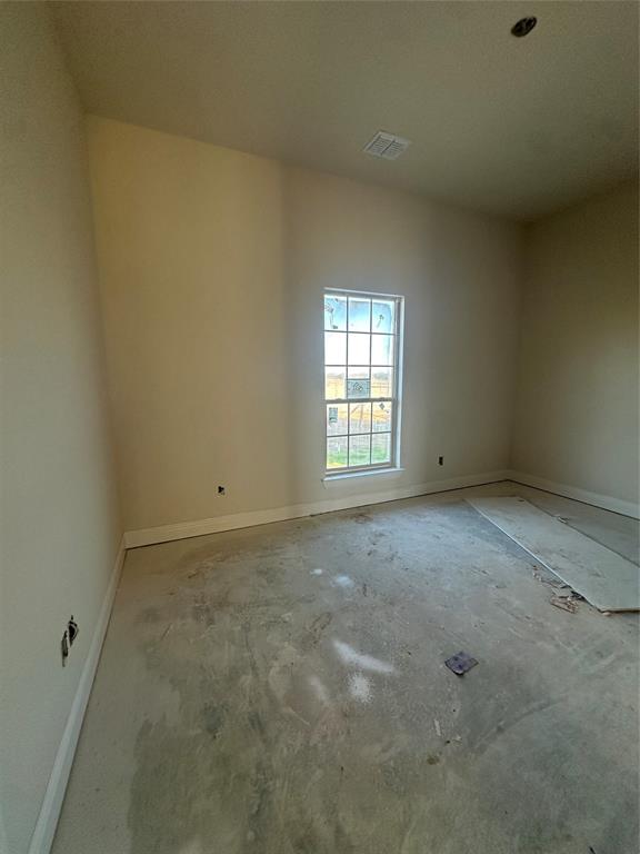 201 Stuart Street Paradise, TX 76073 - Photo 8 of 18 an empty room with windows