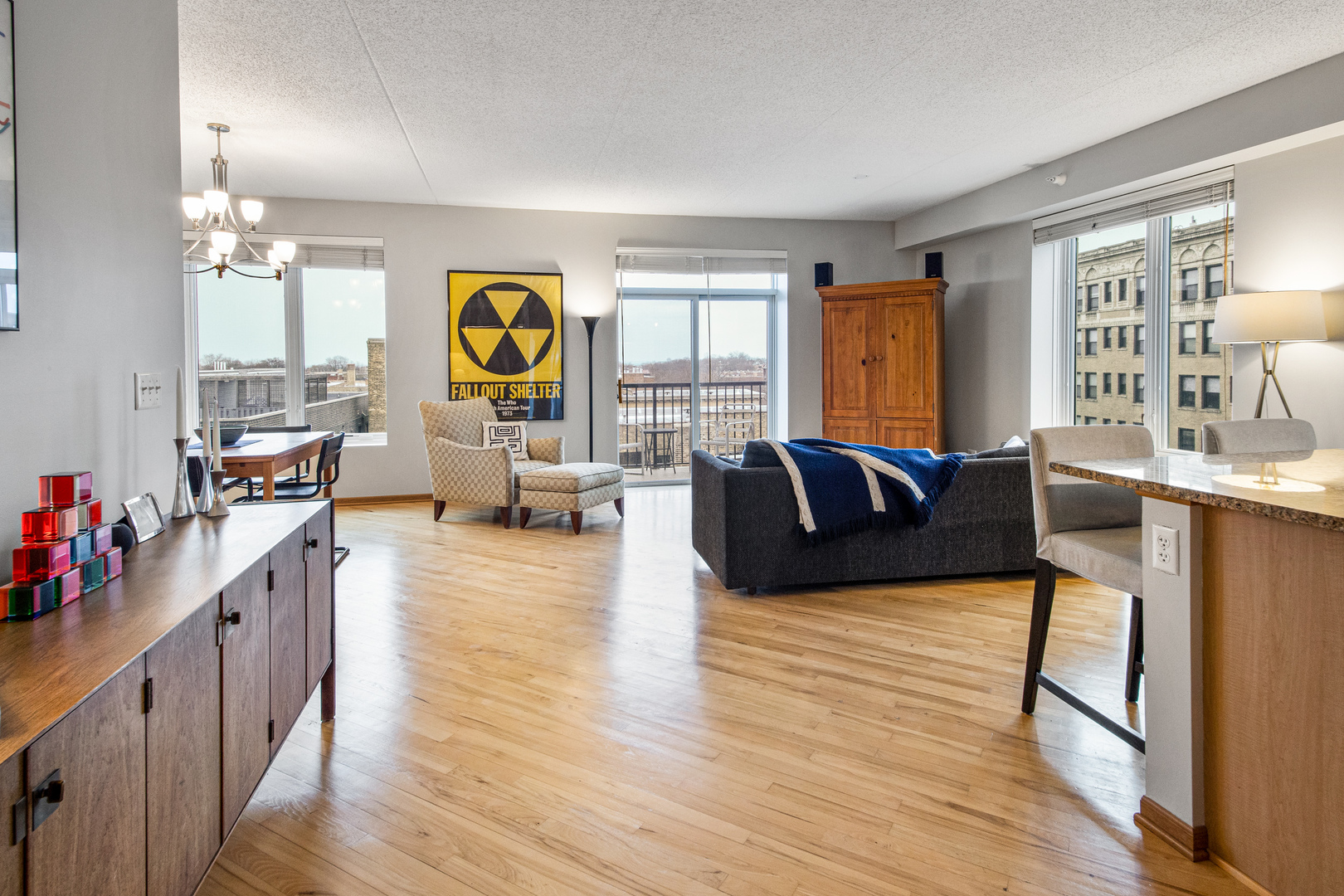 515 Main Street, Unit 505 Evanston, IL 60202 - Photo 3 of 15 a living room with furniture and a wooden floor