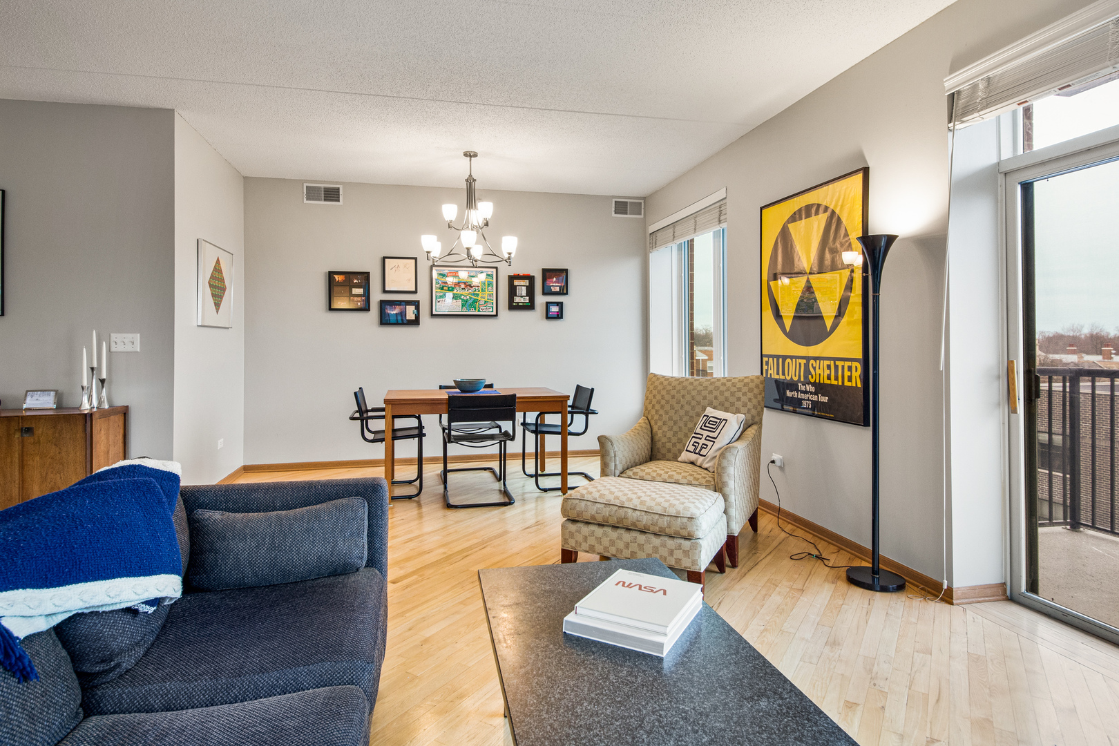 515 Main Street, Unit 505 Evanston, IL 60202 - Photo 7 of 15 a living room with furniture and a chandelier