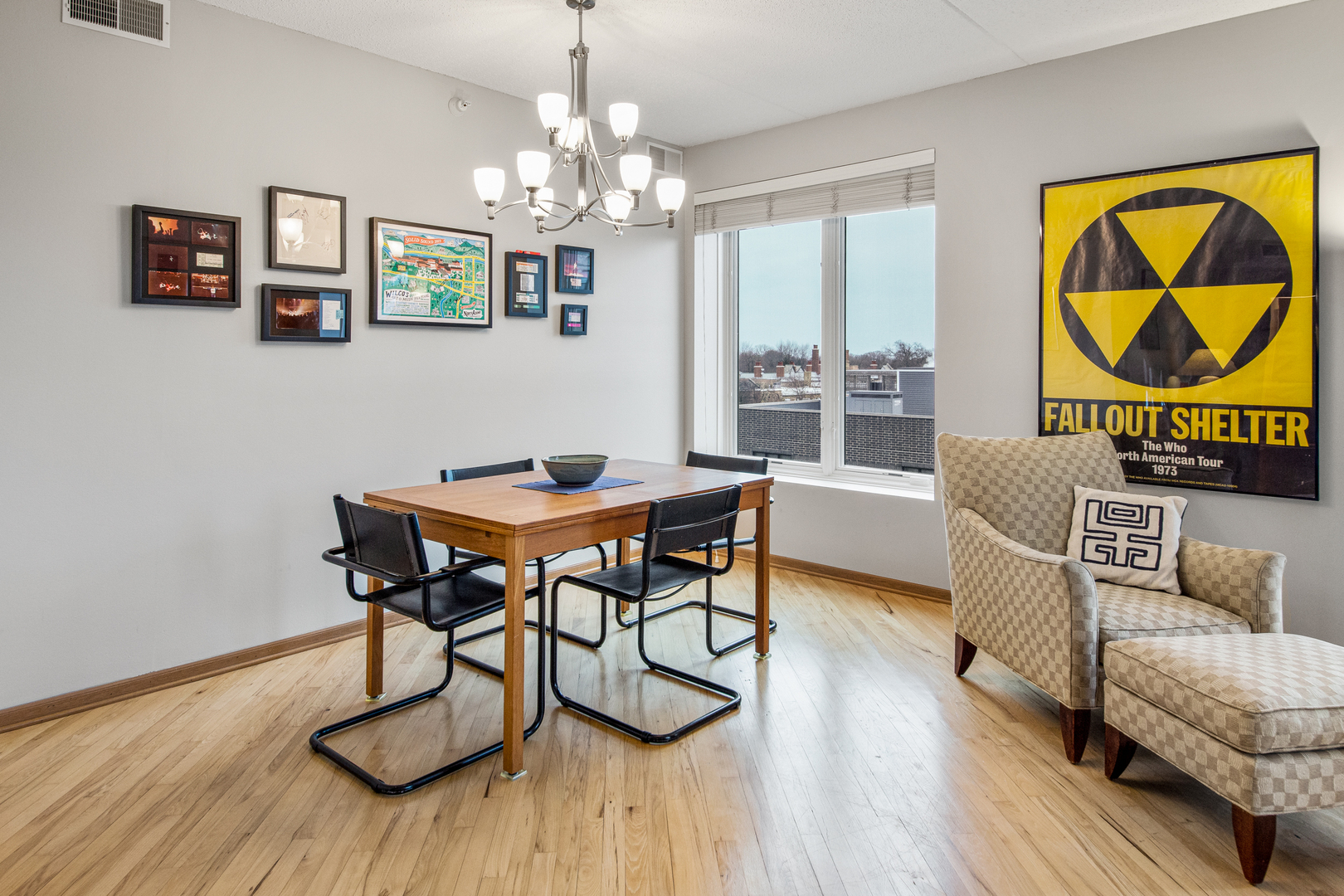 515 Main Street, Unit 505 Evanston, IL 60202 - Photo 8 of 15 a view of a dining room with furniture wooden floor and a chandelier