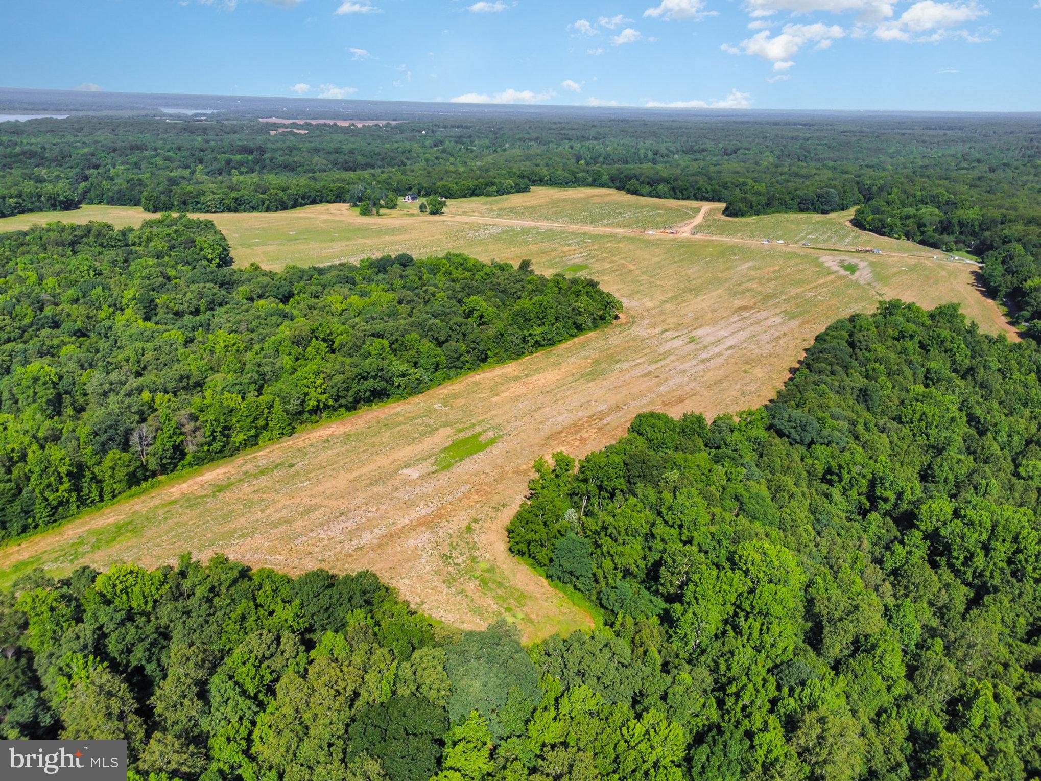 a view of a lake with a yard