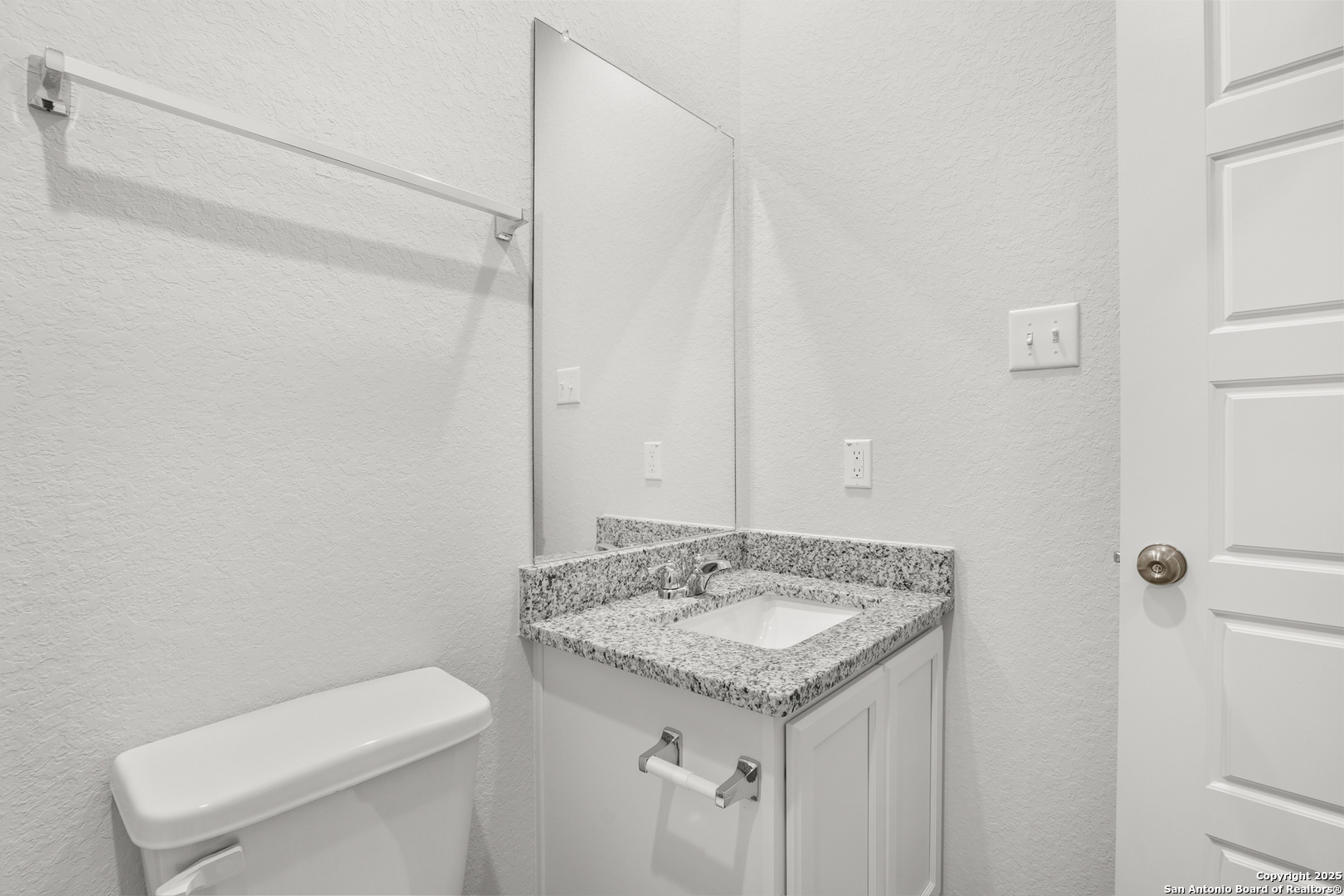 3211 Katzer Lane Converse, TX 78109 - Photo 17 of 28 a bathroom with a granite countertop sink and a toilet