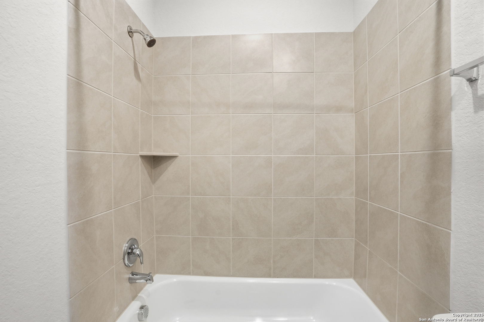 3211 Katzer Lane Converse, TX 78109 - Photo 18 of 28 a bathroom with a shower and a shower