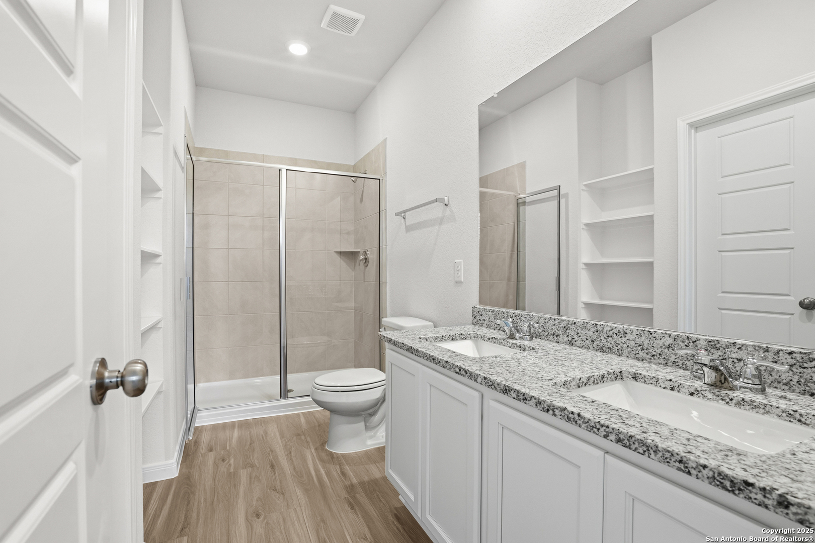 3211 Katzer Lane Converse, TX 78109 - Photo 24 of 28 a bathroom with a granite countertop sink toilet and shower
