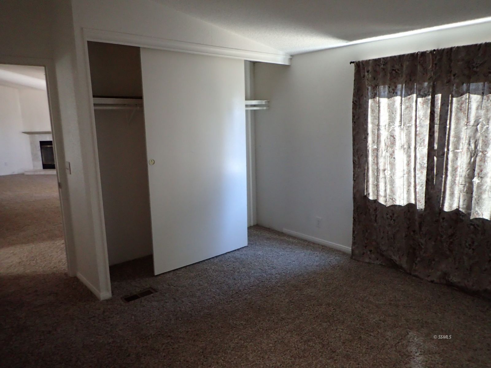 620 West Upjohn Avenue, Unit 31 Ridgecrest, CA 93555 - Photo 8 of 14 an empty room with windows and closet