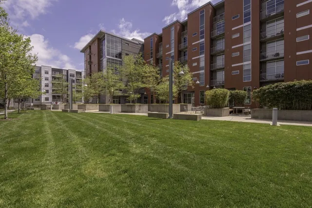 a view of a building with a yard