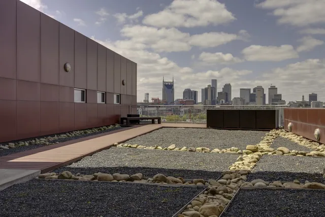 a view of a street with an ocean