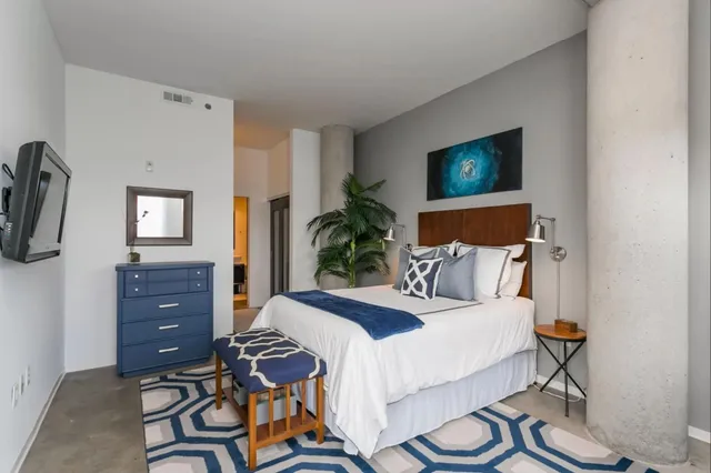 a bedroom with a bed and furniture