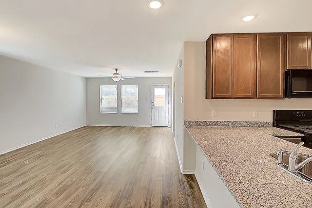 a view of a kitchen cabinets and wooden floor