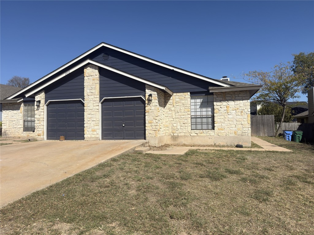 2012 Margalene Way, Unit B Austin, TX 78728 - Photo 1 of 14 a front view of a house with a garage